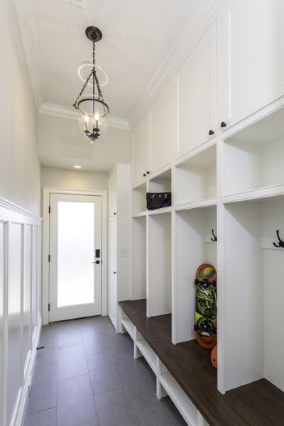 Built in Mudroom White Painted With Stained Wooden Countertop